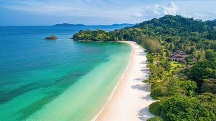 Aerial view of pristine white sand beach meeting turquoise sea surrounded by lush greenery and hills ideal for travel and nature promotions