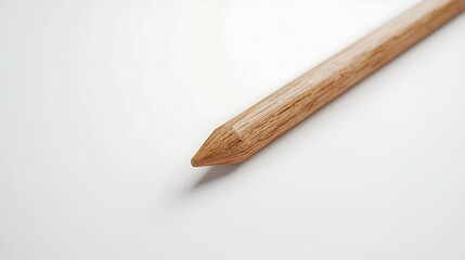 Obraz premium A wooden pencil is shown on a white background