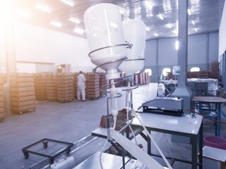 Close up the Vaccination injecting machine for newborn chickens on hatchery production room.