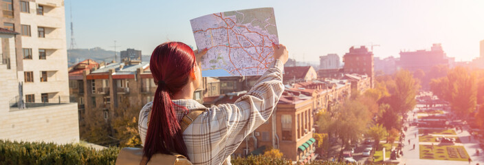 A tourist looks at a map to find his way around the city.
