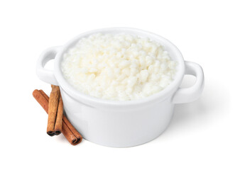 Delicious rice pudding with cinnamon sticks isolated on white