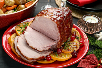 Tasty baked ham served on black wooden table