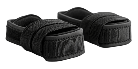  Pair of black foot straps with adjustable Velcro for fitness use. Durable design suitable for gym workouts, ankle support, or cycling. Minimalist and functional style.