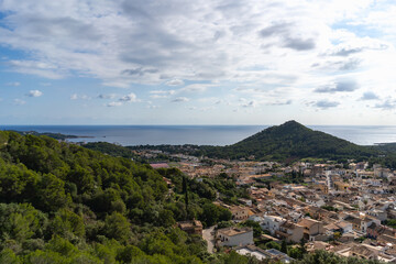 Capdepera, Mallorca, Spain 26.10.2021 Panoramic coastal view from castle hill showing Mediterranean town and sea with mountain backdrop