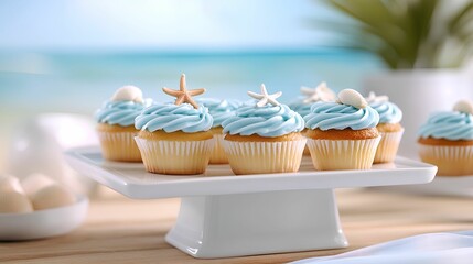 Delicious cupcakes with blue frosting and beach-themed decorations.