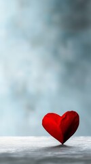 Fototapeta premium A red heart sitting on top of a wooden table