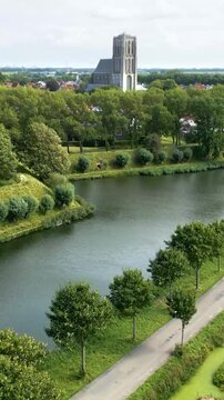 revealing brielle&rsquo;s 17th century church fortifications lush green parks surrounding fortified town upward aerial netherlands motion view landscape dutch history 