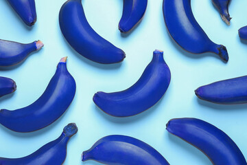 Blue bananas on light background, flat lay