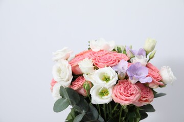 Beautiful wedding bouquet on light background, closeup. Space for text