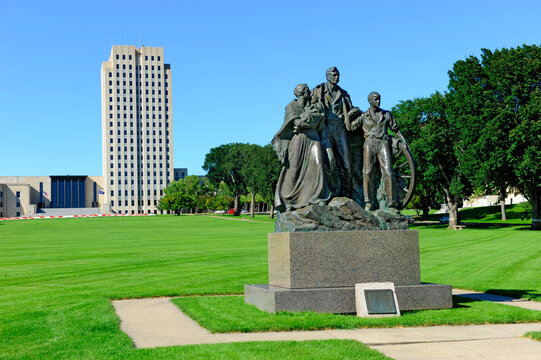 North Dakota State Capitol Building in Bismarck ND.The Pioneer Family Statue was sculpted by Avard Fairbanks and donated in 1946.
