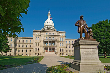 State Capitol Building for Michigan at Lansing Michigan. Austin Blair statue sculpted by Edward Clark Potter of Massachusetts, stands in front of the capitol building