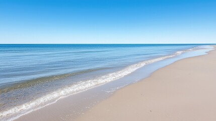 Obraz premium Serene beach landscape with endless horizon and clear blue skies