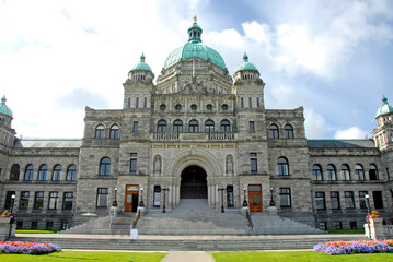 Obraz premium Parliament Buildings Legislative Assembly Victoria British Columbia BC Canada government law rules building neo-baroque design architect Francis Rattenbury. Visitors to seen visiting the capital