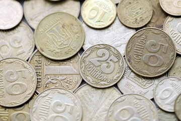 Big pile of different coins from various time period in Ukraine. Shiny Ukrainian money background