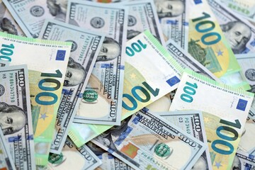 Big pile of Euro and USD banknotes. Many european and united states dollars