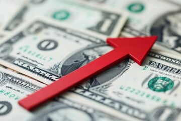 Red Arrow Pointing Upward on Dollar Bills Symbolizing Financial Growth and Market Trends in Close Up View