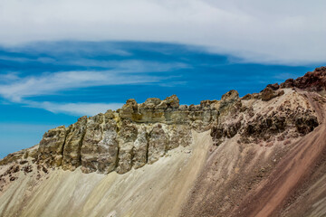 El Misti volcano crater in Peru near the city of Arequipa in Atacama desert. Sandy volcanic slopes covered with ash inside the huge crater of active volcano El Misti on a sunny day with blue sky
