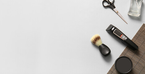 Set of male shaving accessories on light grey background