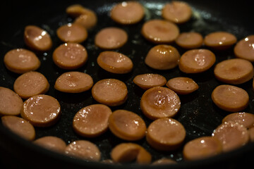 sausage slices in a frying pan
