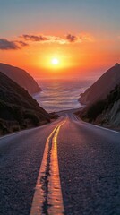 Sunset over the ocean viewed from a winding coastal road
