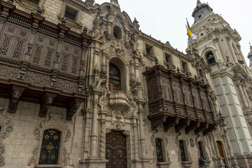 A building with two colonial balconies considered objects of UNESCO world heritage in Lima city centre at a sunny day