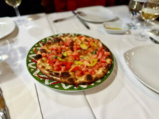 Italian Tomato Bruschetta in pizza shape antipasto