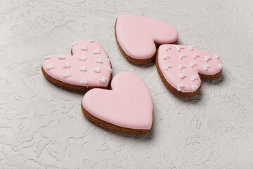 Tasty heart shaped pink cookies on white grunge background. Valentine's Day celebration