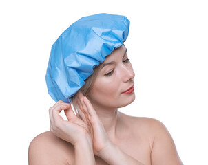 Woman wearing blue shower cap on white background