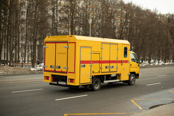 Yellow emergency vehicles. Special equipment on road.