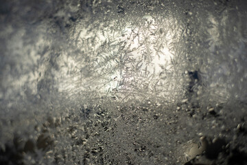 Ice on glass. Frozen car glass. Snowflake on the window.