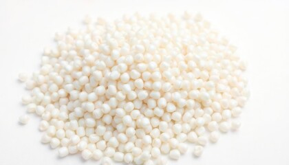 Pile of white sago pearls on white background. Close up view of raw food ingredients. Asian cuisine staple for cooking dessert. Natural, white, mineral rich. Macro food photo ideal for food bloggers,