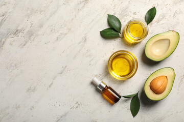 Composition with avocado oil on light background, top view