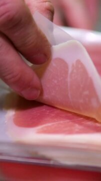Slices Of tasty Jamon or prosciutto On The Wooden Background