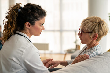 Caring Medical Professional Conducting Thorough Health Examination During Home Visit