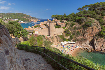 Picturesque view of coastal village and bay in Tossa de Mar with stone houses, Catalonia, Spain,