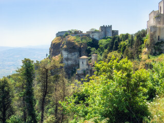 Ancient stone walls and towers of Venus Castle on Erice Mount, showcasing Norman architectural...
