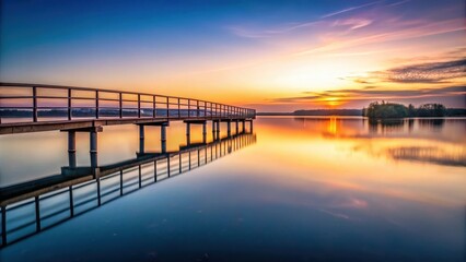 Obraz premium Lonely bridge with calm lake in the background at dusk, sunset, alma mater, sunset,alma mater, reflection, bridge