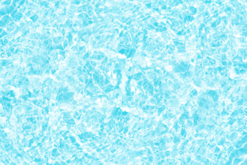 Blue water with ripples on the surface. Defocus blurred transparent blue colored clear calm water surface texture with splashes and bubbles. Water waves with shining pattern texture background.