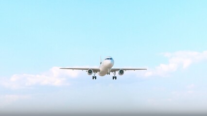 ULTRA HD. Airplane flies in blue sky. Travel, tourism. Airplane takes off against the background of blue sky.	