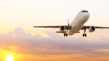 ULTRA HD. Airplane flies in sunset sky. Travel. Airplane takes off against the background of sunset...