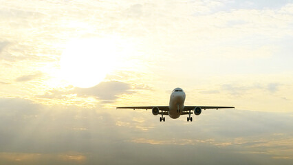 ULTRA HD. Airplane flies in sunset sky. Travel. Airplane takes off against the background of sunset sky. 