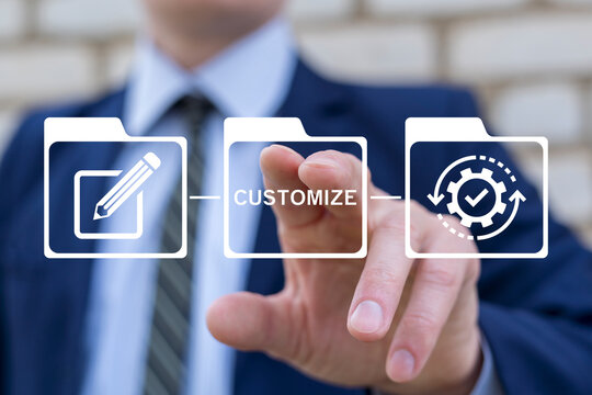 Business person working on virtual touch screen presses word: CUSTOMIZE. Customization Business Product Technology Concept. Adjust, customize and align. Personal changes. System regulation.