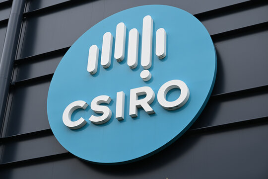Large Australian Commonwealth Scientific and Industrial Research Organisation, or CSIRO, logo mounted on the dark wall of a building