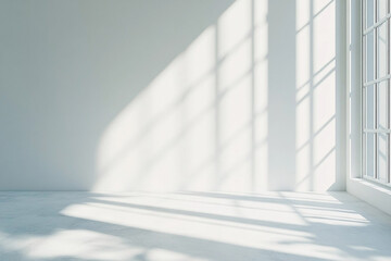 Obraz premium Textured wall in sunlight with plant shadow patterns