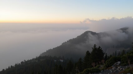 Misty Mountain Sunset: Serene Landscape Above the Clouds
