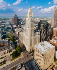 High-angle view of downtown city buildings, including the impressive Keystone Building. Urban landscape, showcasing architectural diversity. DOWNTOWN, COLUMBUS, OHIO, UNITED STATES