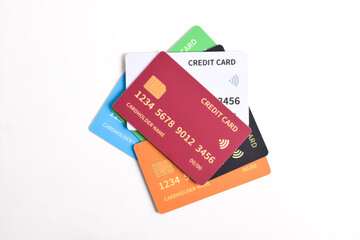 Pile of multicolored credit cards isolated on white background