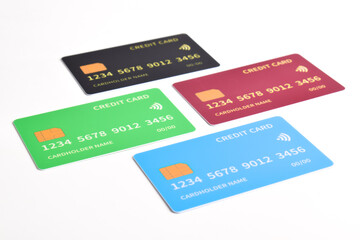 Four credit cards with chip on white background.