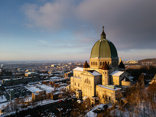 Fototapeta premium Aerial view of St. Josephs Oratory of Mount Royal at Sunset in winter. Montreal, Quebec, Canada