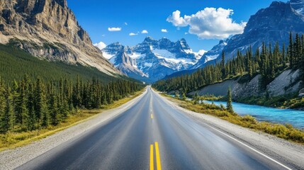 Fototapeta premium An expansive road cutting through the Rockies, crystal-clear river running parallel
